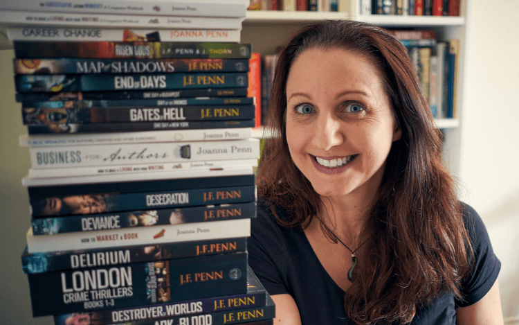 Picture of Joanna Penn beside some of her books.